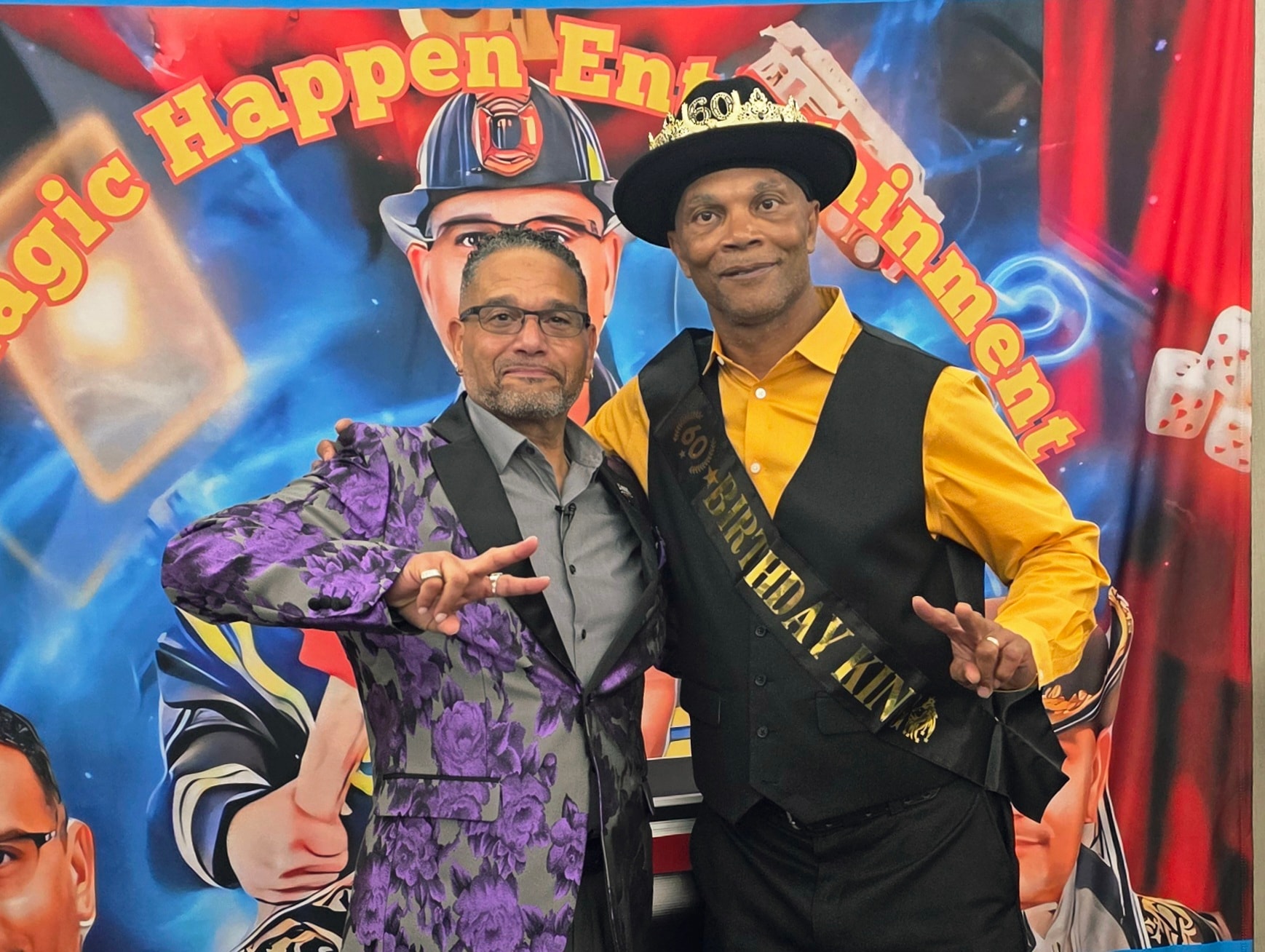 Two men posing at the birthday party
