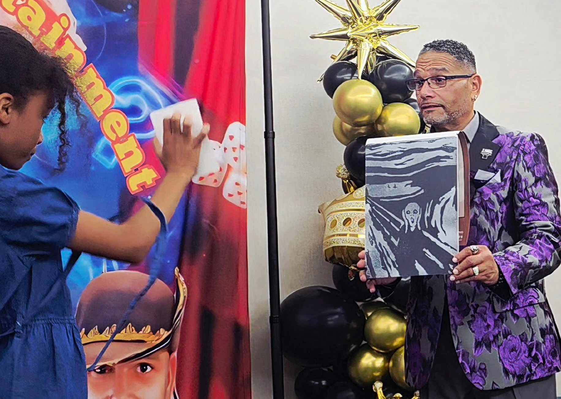 Man displaying artwork at the event