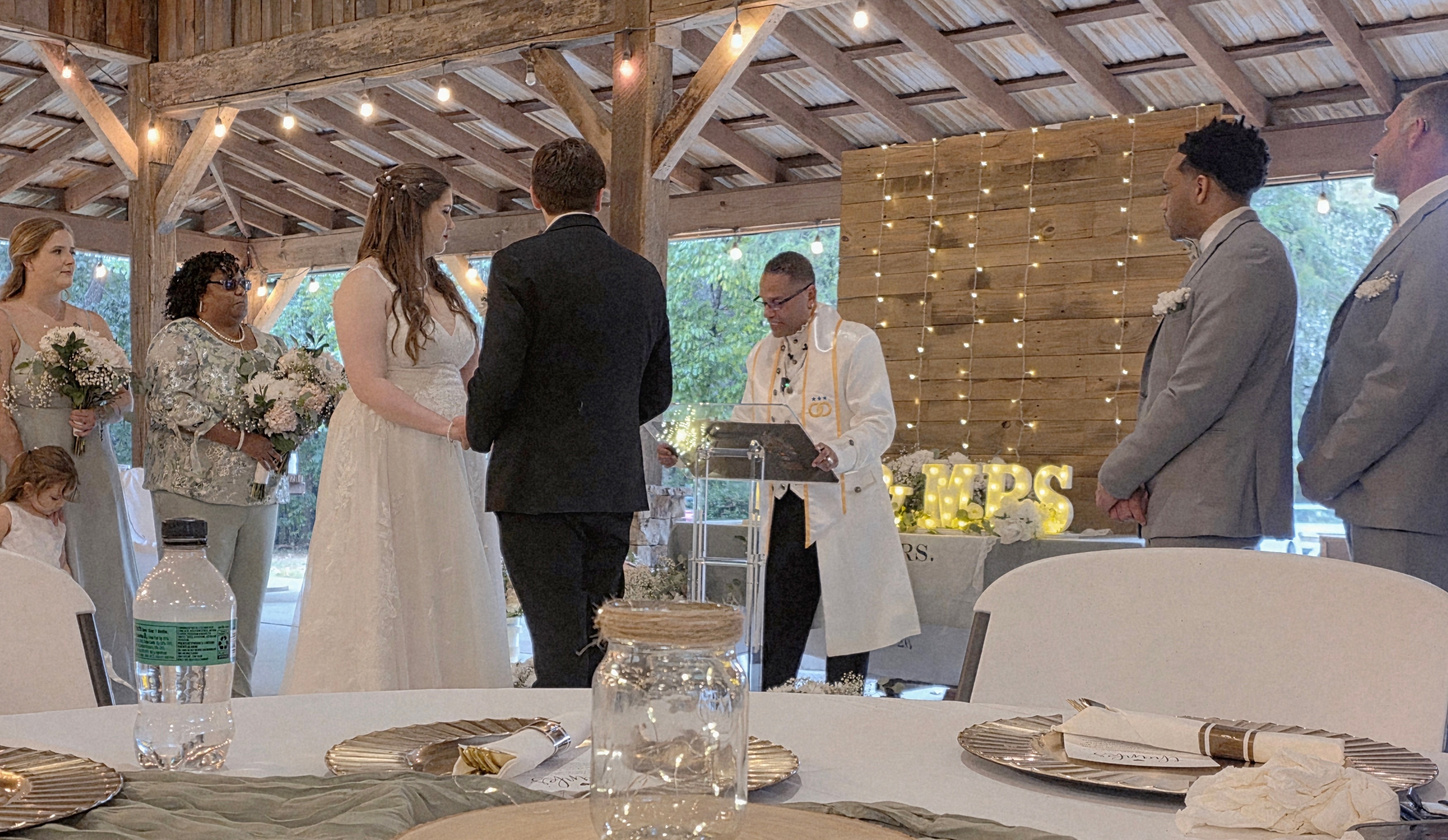 C. Magic reading vows at the altar with bride and groom holding hands
