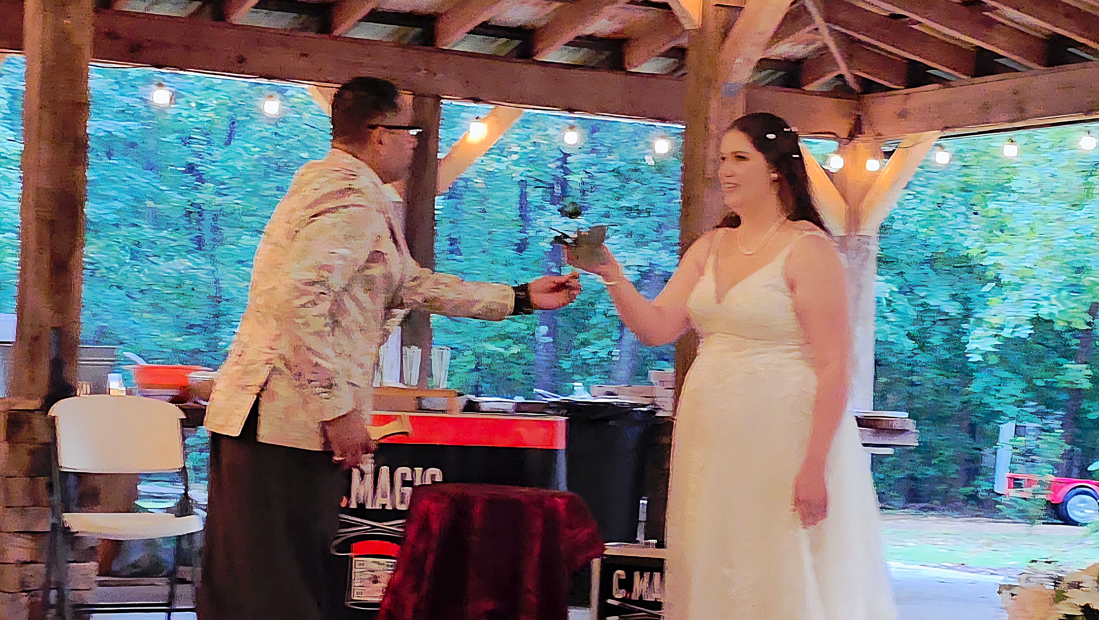 C. Magic and bride performing tablecloth reveal trick filmed by videographer at Kay wedding