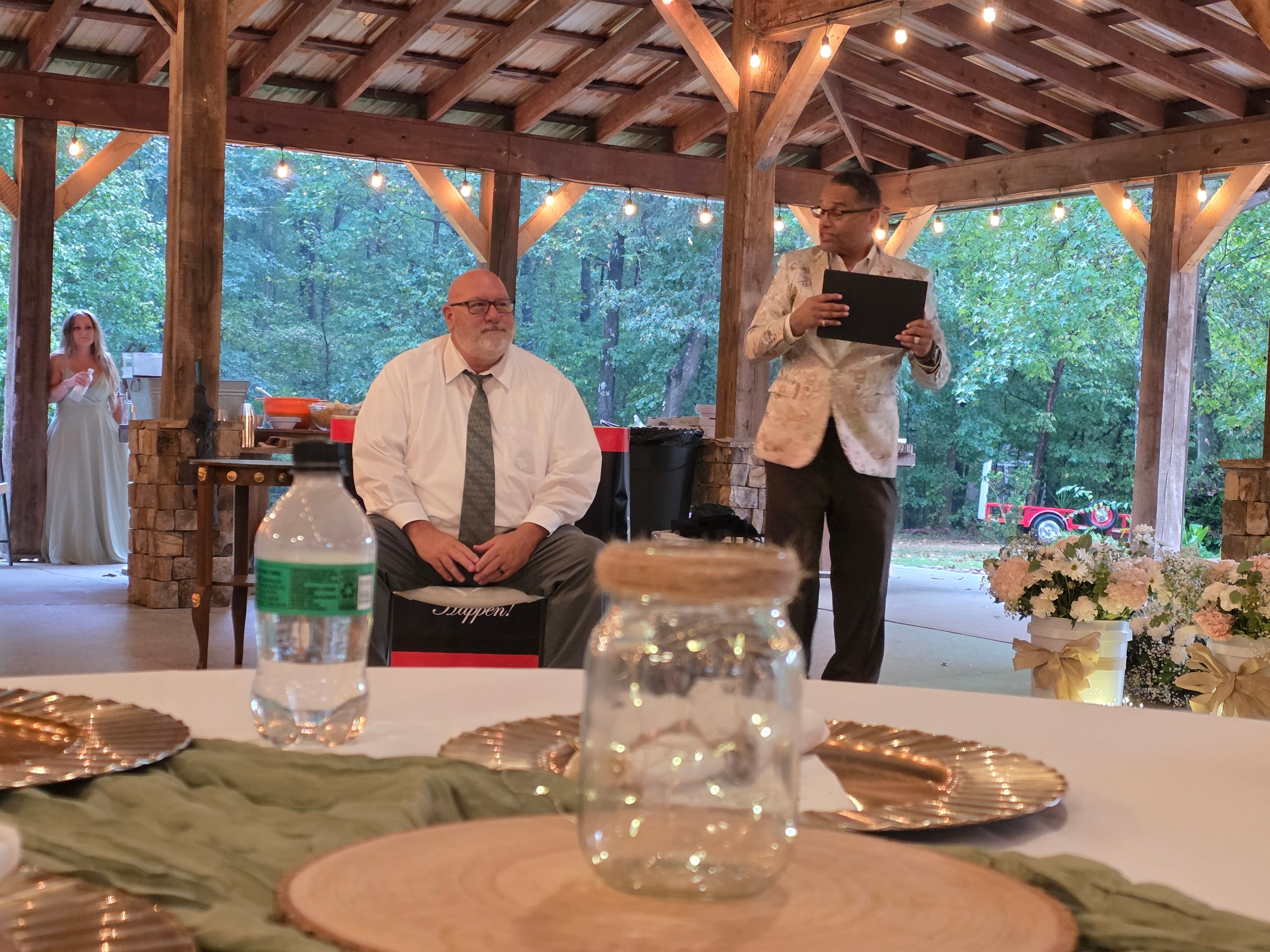 C. Magic performing at the Allen wedding reception with guest seated at table