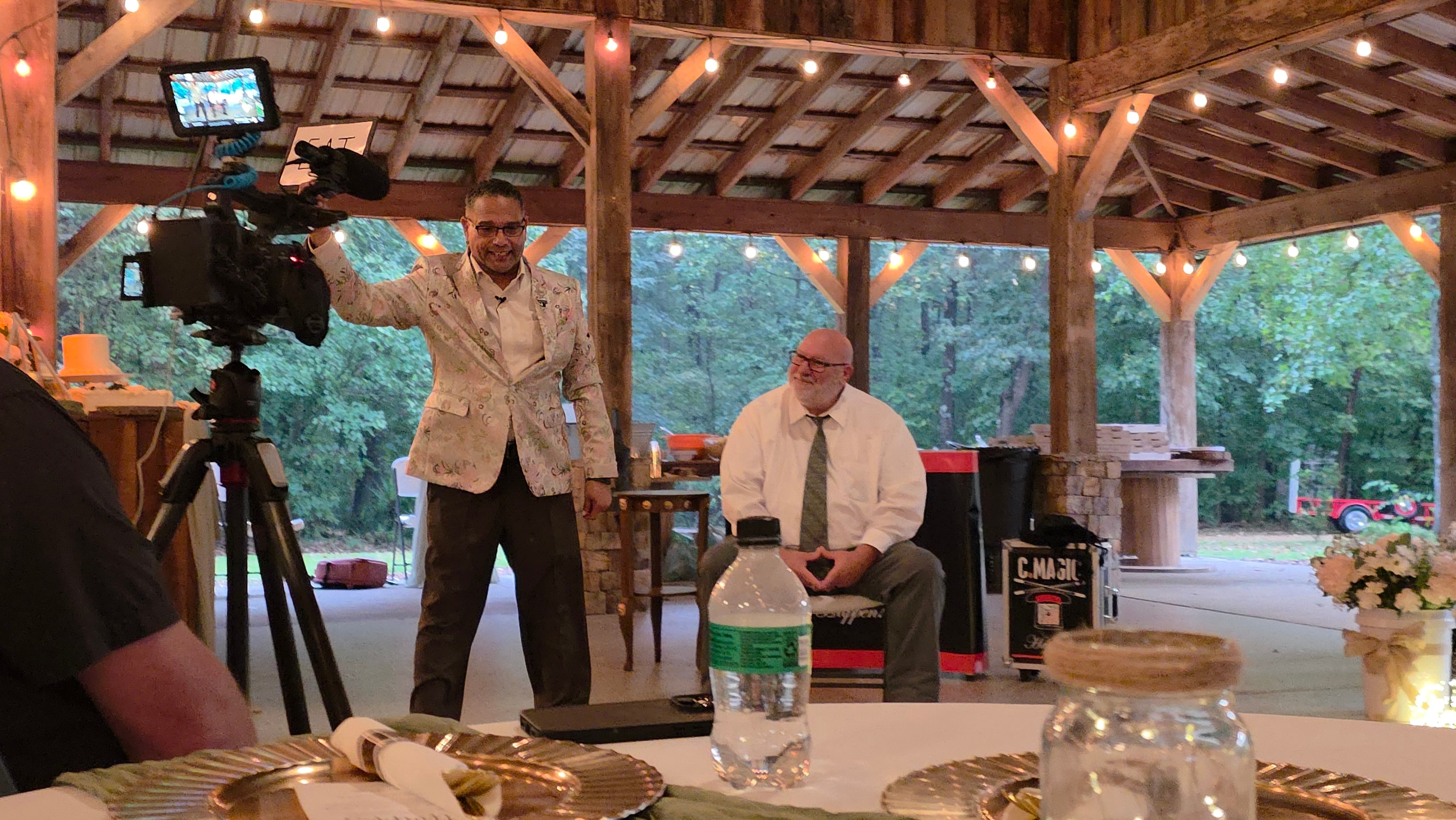 C. Magic performing with videographer filming at the Allen wedding reception