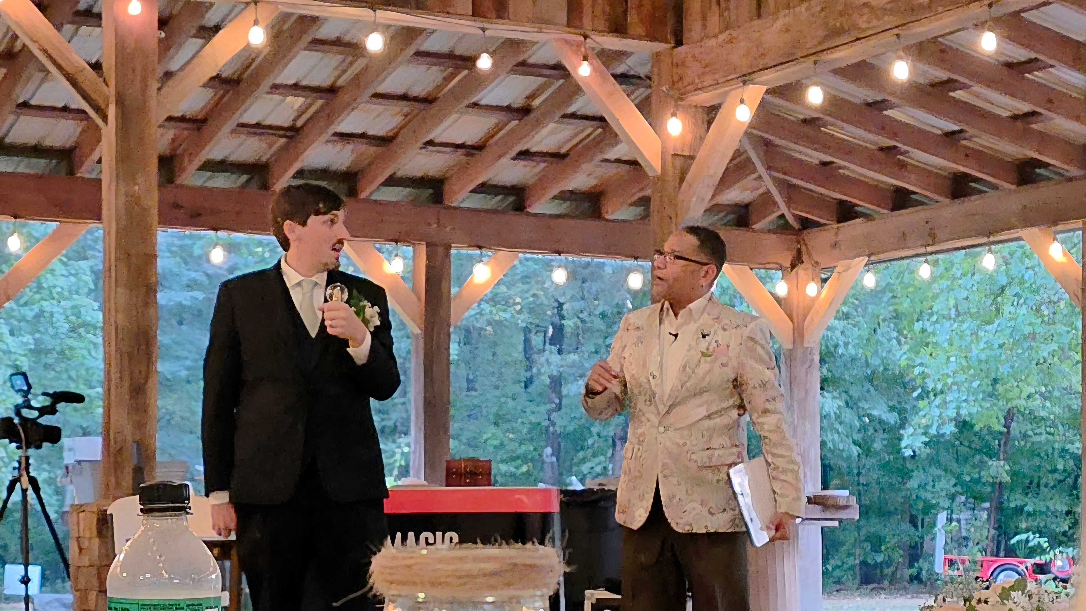 C. Magic performing with groom holding champagne glass at the Allen wedding