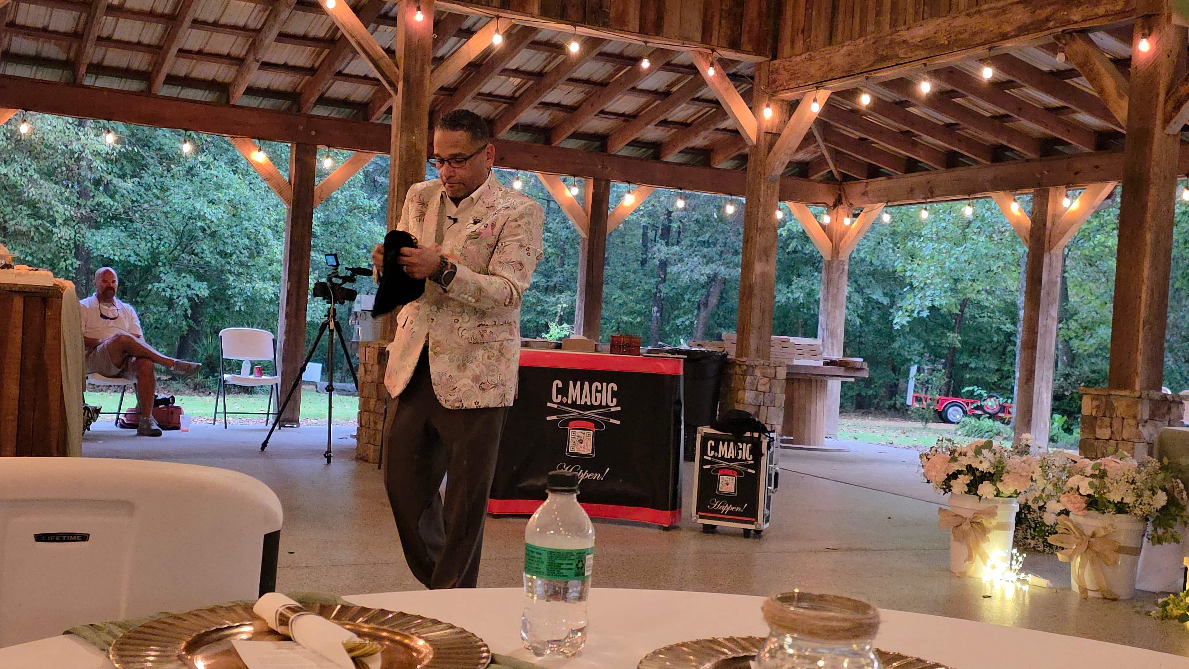 C. Magic preparing magic prop at C. Magic Happen table at the Allen wedding