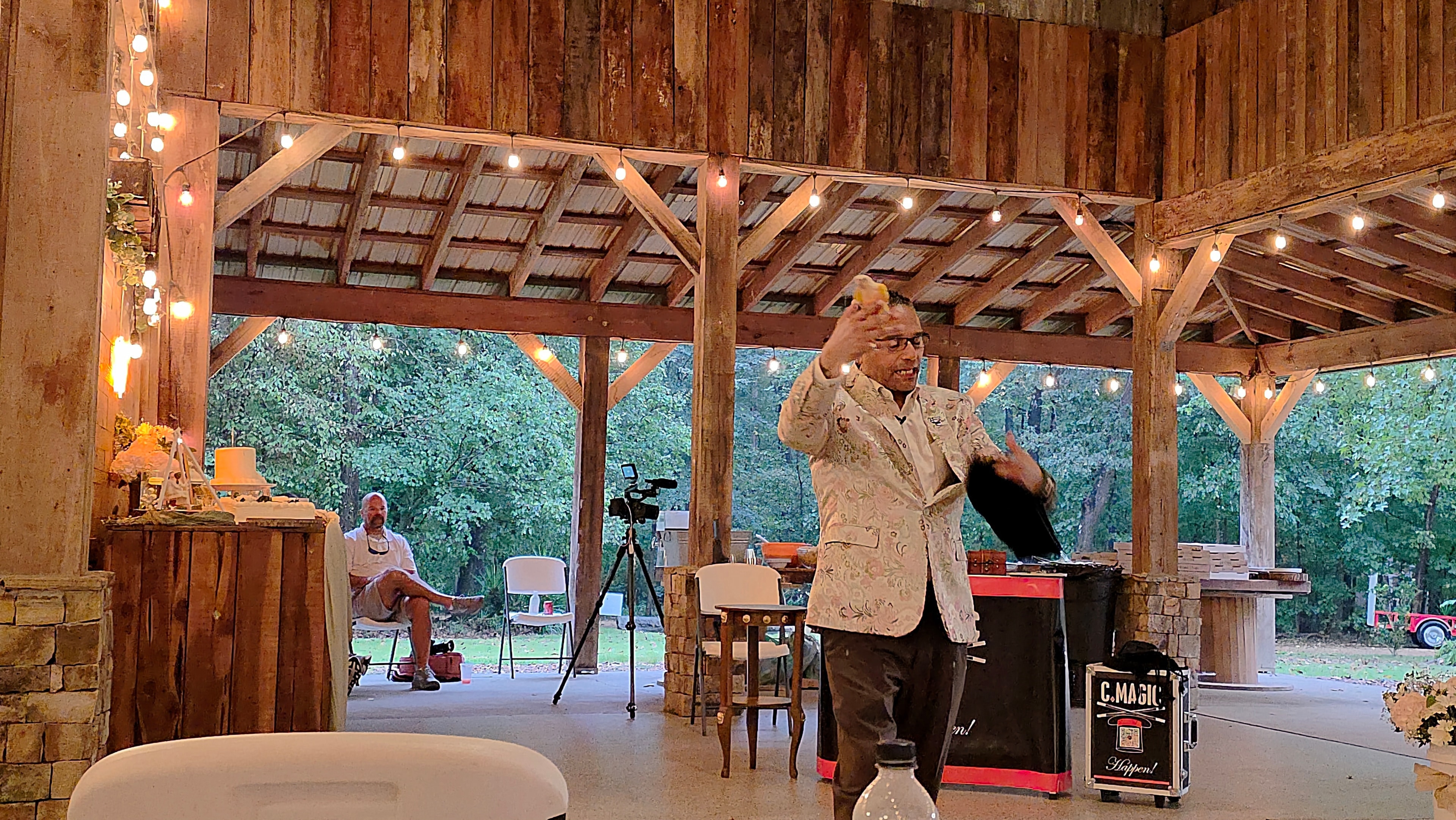 C. Magic performing levitation trick at the Allen wedding pavilion