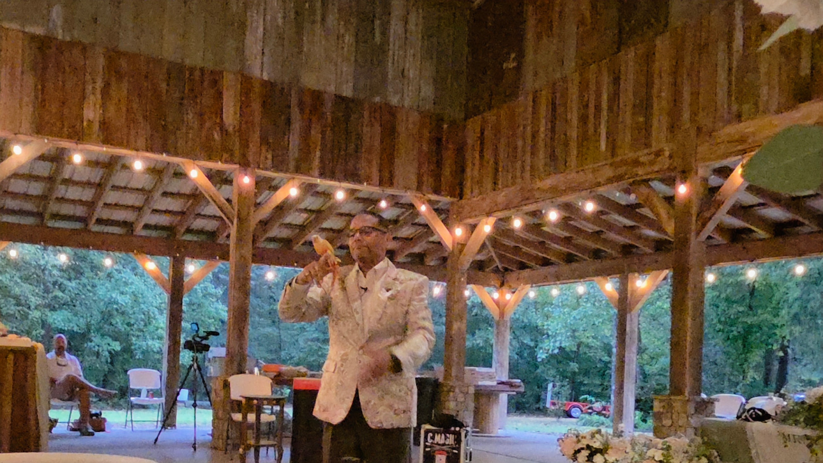 C. Magic performing solo magic trick at the Allen wedding pavilion