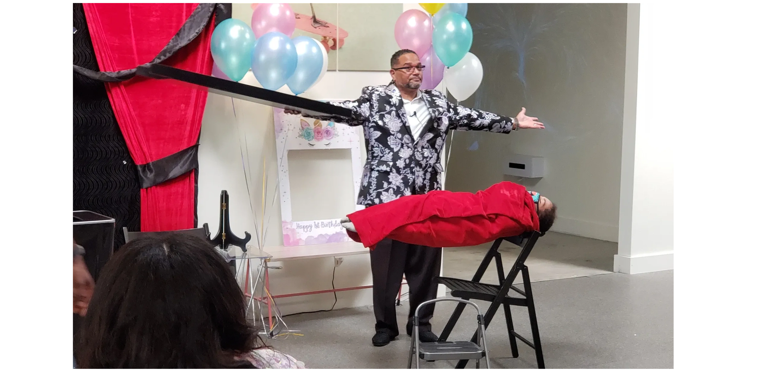 C. Magic performing levitation illusion